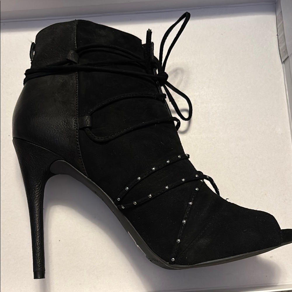Jessica Simpson Sleek Black Heeled Boots with Stiletto and Lace-Up Design